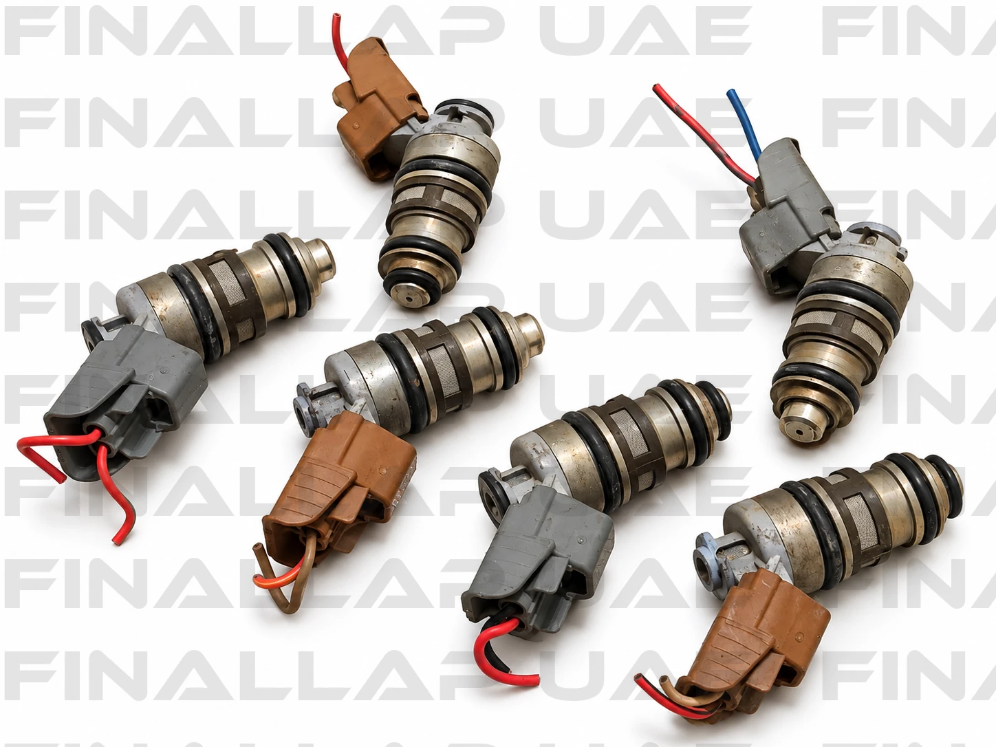 Six Used Fuel Injectors on White (1)