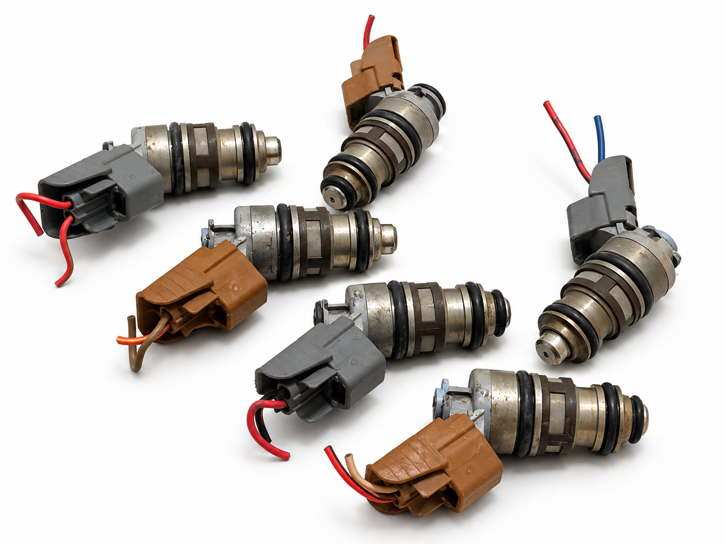 Six Used Fuel Injectors on White (3)